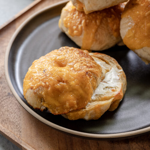 Pickled pepper and cheddar sourdough beer bagels on a plate