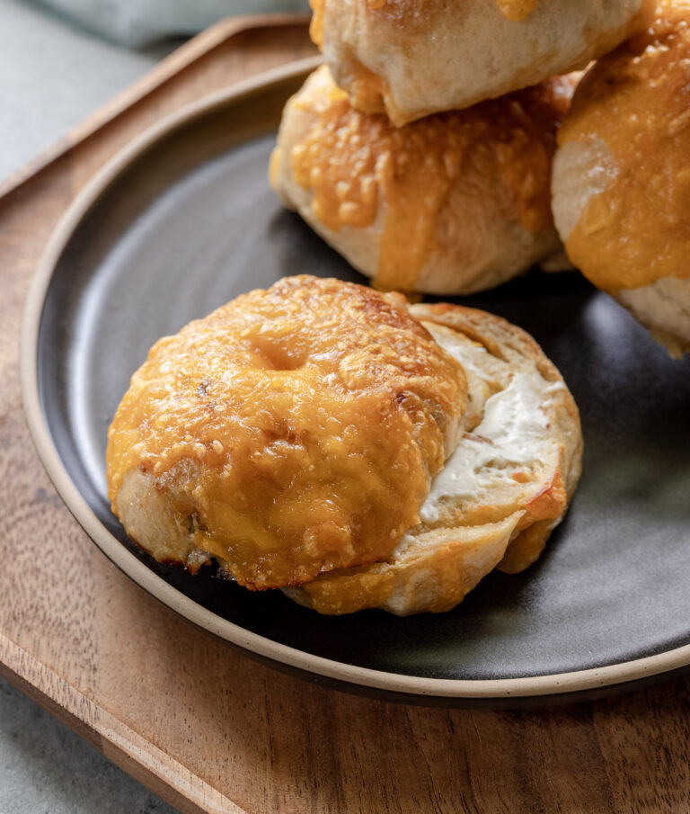 Pickled pepper and cheddar sourdough beer bagels on a plate