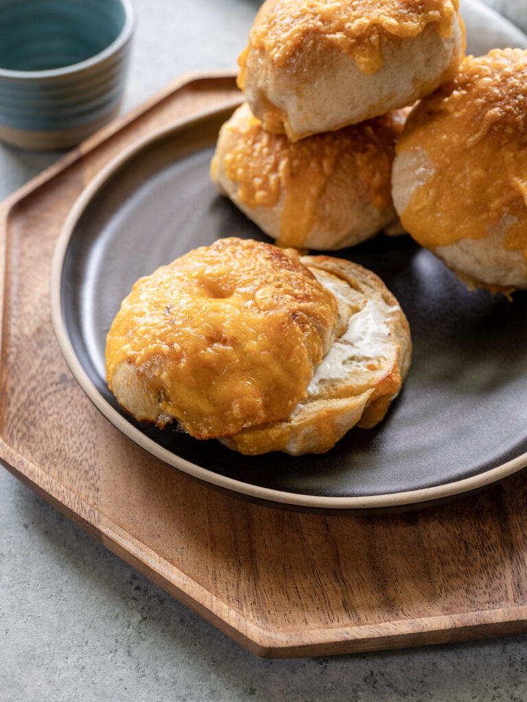 Pickled pepper and cheddar sourdough beer bagels on a plate