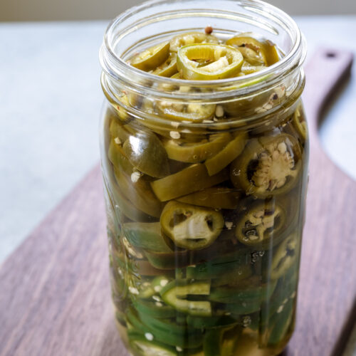 Homemade refrigerator pickled peppers with garlic and pickling spice